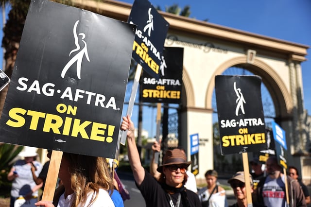 LOS ANGELES, CALIFORNIA - NOVEMBER 03: SAG-AFTRA member Caryn West (C) and other members and supporters picket outside Paramount Studios on day 113 of their strike against the Hollywood studios on November 3, 2023 in Los Angeles, California. Contract negotiations between the actors union and the Alliance of Motion Picture and Television Producers (AMPTP) are continuing in the strike which began on July 14. (Photo by Mario Tama/Getty Images)