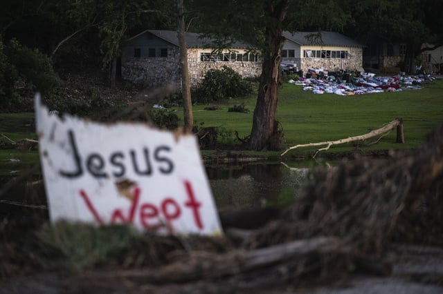 Campers belongings sit outside one of Camp Mystic's cabins near the Guadalupe River, Monday, July 7, 2025, in Hunt, Texas, after a flash flood swept through the area. (AP Photo/Eli Hartman)