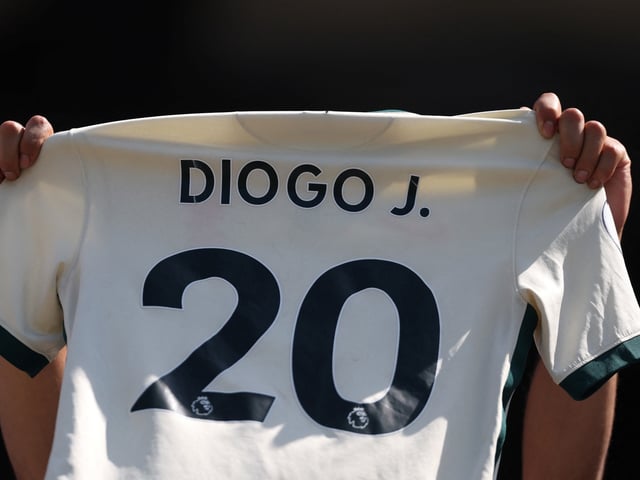 Soccer Football - FIFA Club World Cup - Quarter Final - Real Madrid v Borussia Dortmund - MetLife Stadium, East Rutherford, New Jersey, U.S. - July 5, 2025
A fan holds up a shirt in tribute to Liverpool's Diogo Jota before the match REUTERS/Lee Smith