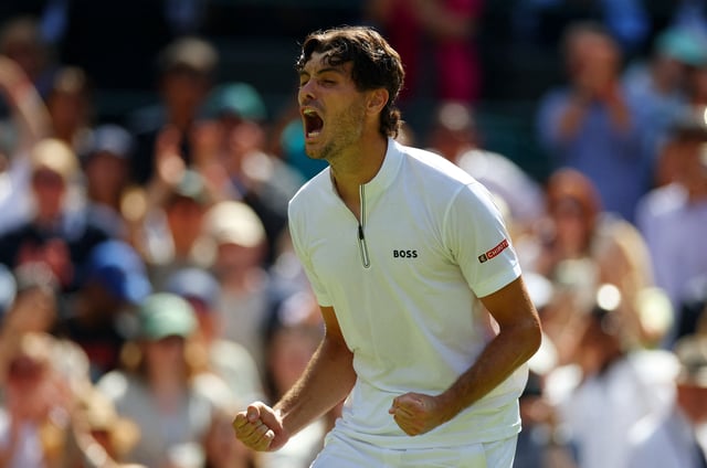 Tennis - Wimbledon - All England Lawn Tennis and Croquet Club, London, Britain - July 8, 2025 Taylor Fritz of the U.S. celebrates winning his quarter final match against Russia's Karen Khachanov REUTERS/Isabel Infantes