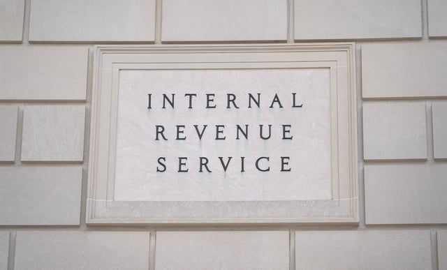 A sign is seen at the U.S. Internal Revenue Service (IRS) building after it was reported the IRS will lay off about 6,700 employees, a restructuring that could strain the tax-collecting agency's resources during the critical tax-filing season, in Washington, D.C., February 20, 2025. REUTERS/Kent Nishimura/File Photo