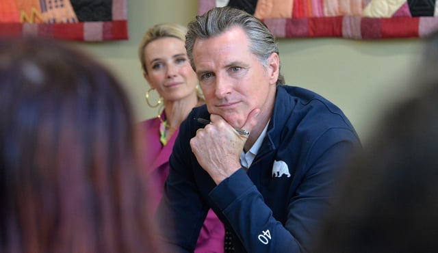 California Gov. Gavin Newsom and First Partner Jennifer Newsom, listen to students from New College of Florida on Wednesday during Newsom’s stop at the Betty J. Johnson North Sarasota Public Library in Sarasota on April 5, 2023.
