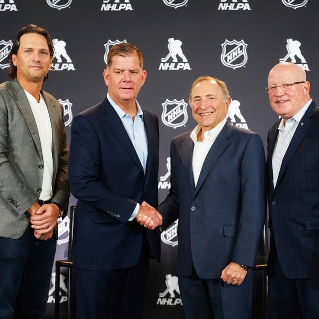 From left to right, Ron Hainsey, NHLPA Assistant Executive Director, Marty Walsh, NHLPA Executive Director, Gary Bettman, NHL Commissioner, and Bill Daly, NHL Deputy Commissioner, pose for photos after a joint press conference before the NHL hockey draft Friday, June 27, 2025, in Los Angeles. (AP Photo/Damian Dovarganes)