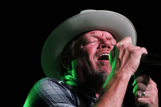 Green light appropriately illuminates singer Pat Green during his show at Potosi Live. on Aug. 21, 2021.