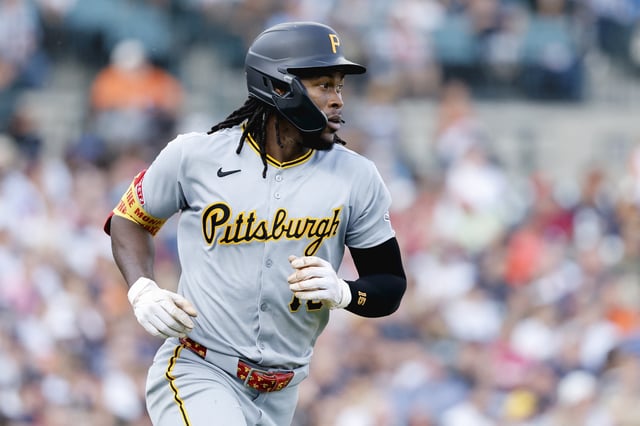 Jun 17, 2025; Detroit, Michigan, USA;  Pittsburgh Pirates outfielder Oneil Cruz (15) runs to first after hitting a single in the fourth inning against the Detroit Tigers at Comerica Park. Mandatory Credit: Rick Osentoski-Imagn Images/File Photo