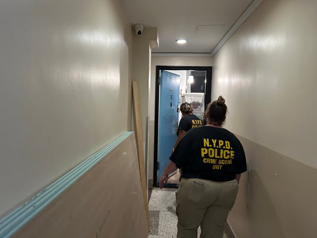 Members of the NYPD remove caged parakeets from a seventh-floor apartment Barnes Ave. in the Bronx after a woman found dead at the location on July 7, 2025. (Kerry Burke / New York Daily News)