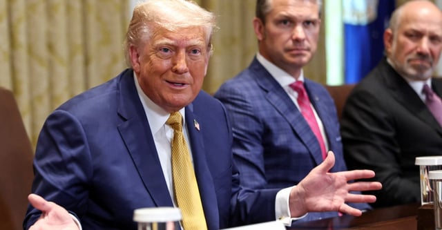 U.S. President Donald Trump speaks next to Defense Secretary Pete Hegseth and Secretary of Commerce Howard Lutnick during a cabinet meeting at the White House in Washington, D.C., U.S., July 8, 2025. REUTERS/Kevin Lamarque