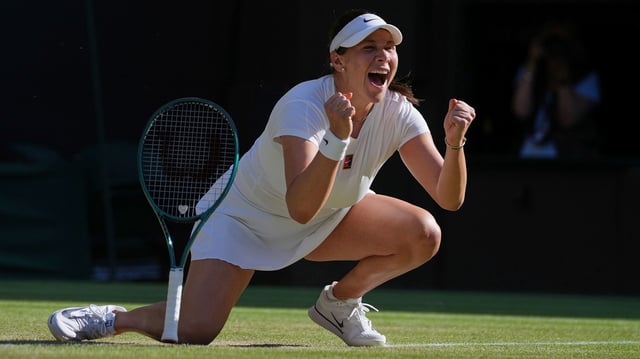 Amanda Anisimova of the U.S. celebrates winning the women's singles quarter finals match against Anastasia Pavlyuchenkova of Russia at the Wimbledon Tennis Championships in London, Tuesday, July 8, 2025.(AP Photo/Kin Cheung)