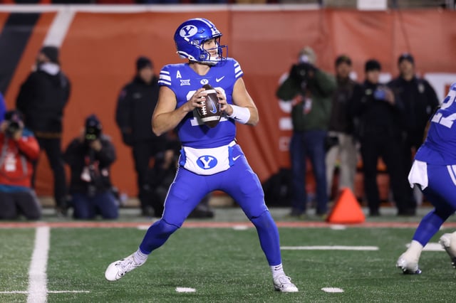 Nov 9, 2024; Salt Lake City, Utah, USA; Brigham Young Cougars quarterback Jake Retzlaff (12) drops back to pass against the Utah Utes during the third quarter at Rice-Eccles Stadium. Mandatory Credit: Rob Gray-Imagn Images/File Photo