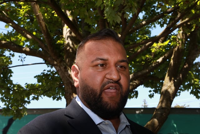 Then-NDP candidate, now B.C. Forests Minister Ravi Parmar answers questions from the media while in Langford, B.C., on Thursday, May 25, 2023. THE CANADIAN PRESS/Chad Hipolito
