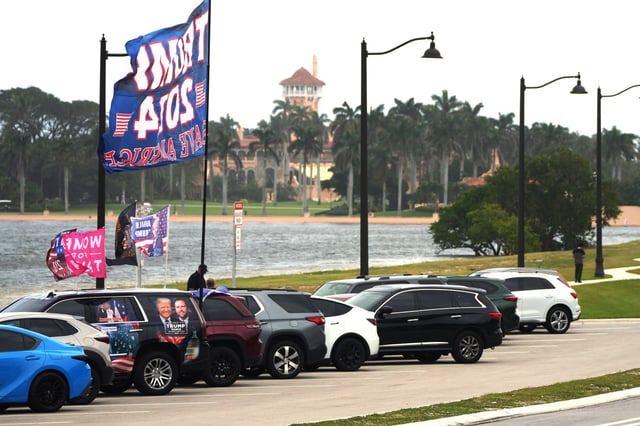 Trump supporters gather on Election Day along Southern Blvd., not far from Mar-a-Lago, the residence of former president Donald Trump, who is running again for the presidency against Kamala Harris on Tuesday, Nov. 5, 2024. (Jim Rassol/Contributor)