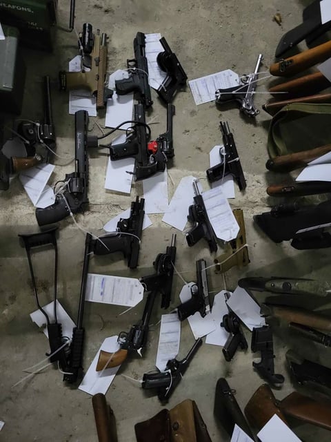 Numerous firearms, depicted here, were seized by police officers during searches in January 2024 as part of an investigation into an alleged terror plot, according to Canadian authorities.