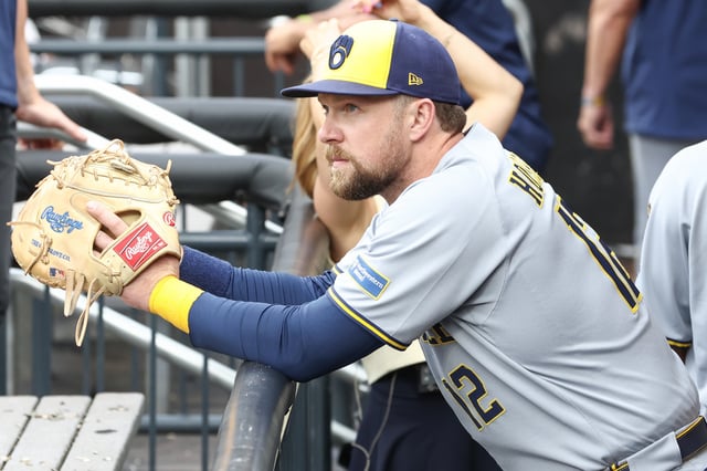 Jul 2, 2025; New York City, New York, USA;  Milwaukee Brewers first baseman Rhys Hoskins (12) watches from the dugout prior to game against the New York Mets at Citi Field. Mandatory Credit: Wendell Cruz-Imagn Images/File Photo