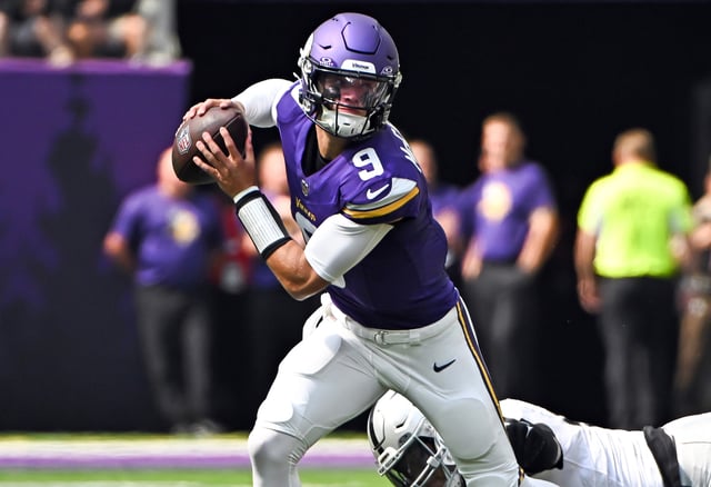 J.J. McCarthy #9 of the Minnesota Vikings evades a tackle as he looks to pass the ball in the second quarter of the preseason game against the Las Vegas Raiders at U.S. Bank Stadium on August 10, 2024 in Minneapolis, Minnesota.