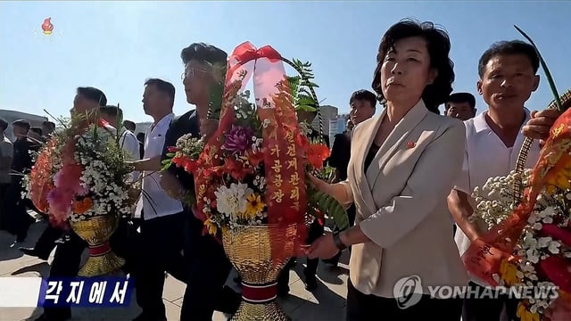 This image of North Koreans mourning state founder Kim Il-sung on the day of his 31st death anniversary on July 8, 2025, is captured from the Korean Central Television. (For Use Only in the Republic of Korea. No Redistribution) (Yonhap)
