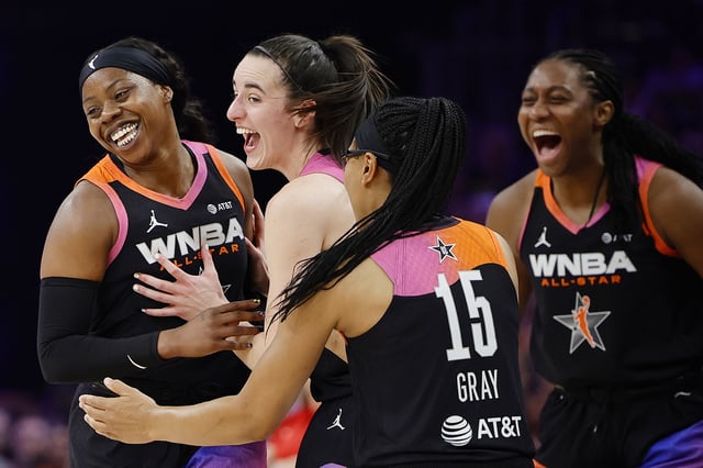 Arike Ogunbowale #24 celebrates a three point basket with Caitlin Clark #22 and Allisha Gray #15 of Team WNBA in the second half against Team USA during the 2024 WNBA All Star Game at Footprint Center on July 20, 2024 in Phoenix, Arizona. Team WNBA beat Team USA 117-109.