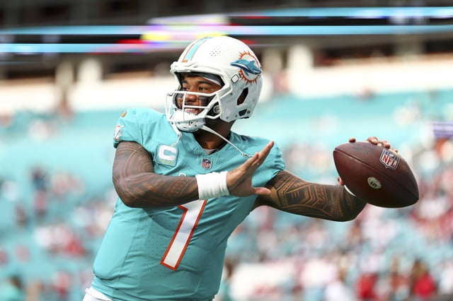 Tua Tagovailoa #1 of the Miami Dolphins warms up before an NFL football game against the San Francisco 49ers at Hard Rock Stadium on December 22, 2024 in Miami Gardens, Florida.