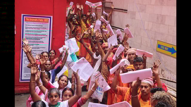 Pilgrims waiting to register themselves for the annual Amarnath Yatra in Jammu on Tuesday. (PTI)