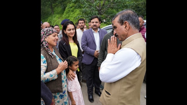 Himachal Pradesh chief minister Sukhvinder Singh Sukhu interacts with people affected by the collapse of a retaining wall constructed by NHAI in Shimla on Tuesday. (PTI)