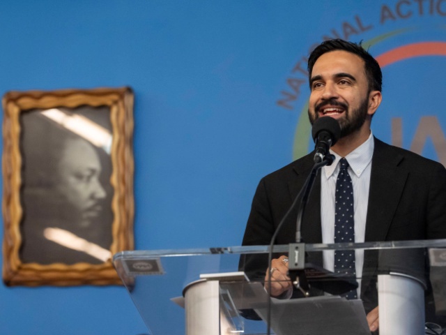 Democratic mayoral candidate Zohran Mamdani speaks next to a portrait of Martin Luther King Jr. during the National Action Network's Saturday action rally at House of Justice in Harlem, Saturday, June 28, 2025, in New York. (AP Photo/Yuki Iwamura)