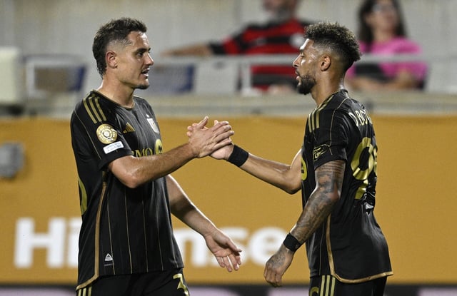 LAFC’s Denis Bouanga, right, celebrates his goal with teammate Aaron Long during a FIFA Club World Cup match against Flamengo last month in Orlando, Fla. (AP Photo/Phelan M. Ebenhack)