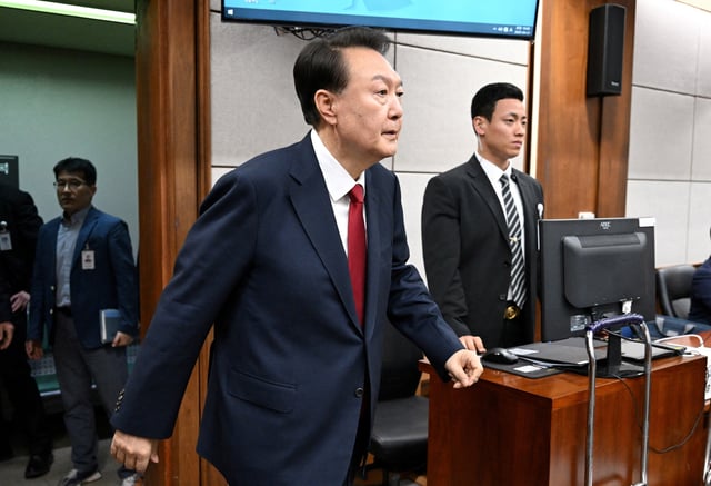 South Korea's former president Yoon Suk Yeol arrives to attend his criminal trial on insurrection charges at a courtroom of the Seoul Central District Court in Seoul on April 21, 2025.     JUNG YEON-JE/Pool via REUTERS/File Photo