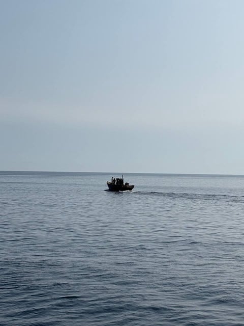 A wooden boat carrying North Koreans moves northward in the East Sea on July 9, 2025, in this photo provided by the unification ministry. (PHOTO NOT FOR SALE)