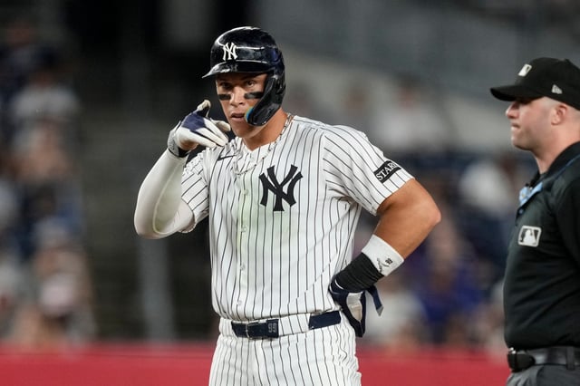 New York Yankees&#39; Aaron Judge (99) reacts after hitting a single during the sixth inning of a baseball game against the Seattle Mariners, Tuesday, July 8, 2025, in New York. (AP Photo/Yuki Iwamura)