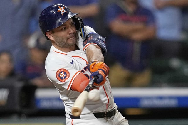 Houston Astros&#39; Jose Altuve hits a RBI single against the Cleveland Guardians during the eighth inning of a baseball game Tuesday, July 8, 2025, in Houston. (AP Photo/David J. Phillip)