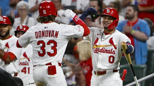 Jul 8, 2025; St. Louis, Missouri, USA;  St. Louis Cardinals left fielder Brendan Donovan (33) celebrates with shortstop Masyn Winn (0) after hitting a two run home run against the Washington Nationals during the third inning at Busch Stadium. Mandatory Credit: Jeff Curry-Imagn Images