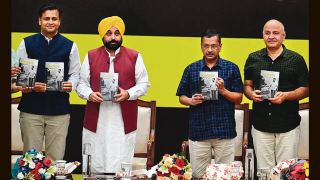 (From left) Author Jasmine Shah, Punjab chief minister Bhagwant Mann, AAP national convener Arvind Kejrwal and former Delhi chief minister Manish Sisodia during the launch of the Punjabi edition of Shah’s book ‘Kejriwal Model’. (Sanjeev Sharma/HT)