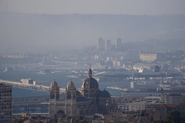 Smoke rises over Marseille as a fast-moving wildfire spreads on the outskirts the city, southern France, July 8, 2025. REUTERS/Alexandre Dimou