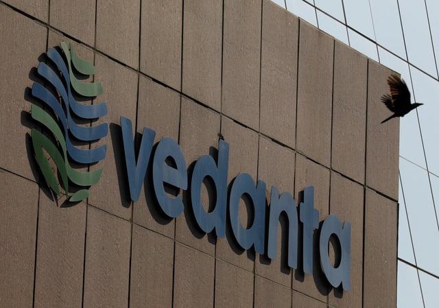 A bird flies past the logo of Vedanta installed on the facade of its headquarters in Mumbai, India January 31, 2018. REUTERS/Danish Siddiqui/File Photo