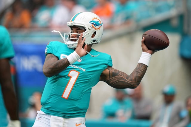 Miami Dolphins quarterback Tua Tagovailoa (1) warms up before an NFL football game against the San Francisco 49ers Sunday, Dec. 22, 2024, in Miami Gardens, Fla. (AP Photo/Rebecca Blackwell)