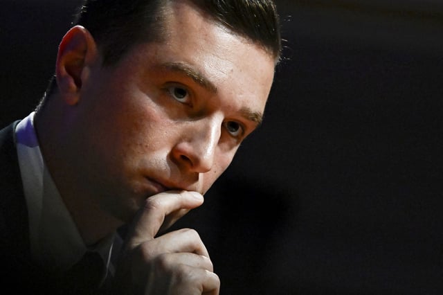 French far-right Rassemblement National (RN) party President and lead MEP Jordan Bardella  looks on during a meeting with French employers' association Movement of the Enterprises of France (MEDEF) gathering party and coalition leaders ahead of legislative elections, in Paris on June 20, 2024. 