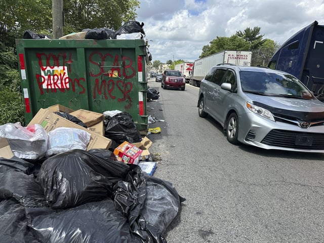 Trash piles up around dumpsters in Philadelphia as thousands of city workers remained on strike Monday, July 7, 2025. (AP Photo/Tassanee Vejpongsa)