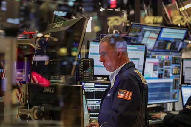 A trader works on the floor at the New York Stock Exchange (NYSE) in New York City, U.S., July 8, 2025. REUTERS/Jeenah Moon/File Photo