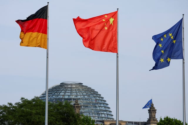 The flags of Germany, China and the European Union are seen ahead of a meeting between German Chancellor Olaf Scholz and Chinese Premier Li Qiang in Berlin, Germany, June 19, 2023. REUTERS/Fabrizio Bensch/File Photo