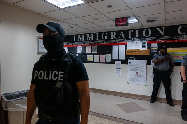 Federal agents patrol the halls of immigration court at the Jacob K. Javitz Federal Building on July 08, 2025 in New York City.