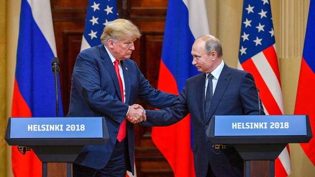US President Donald Trump (L) and Russia's President Vladimir Putin shake hands before attending a joint press conference. (File image)
