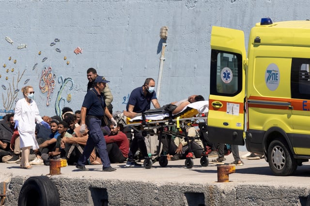 Medics transfer a migrant to an ambulance, after Greece rescued hundreds of migrants off the islands of Gavdos and Crete in separate incidents, according to the Greek Coast Guard, in the port of Agia Galini, Greece, July 6, 2025. REUTERS/Stefanos Rapanis/File Photo