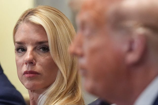 Attorney General Pam Bondi, left, listens as President Donald Trump, right, speaks during a cabinet meeting at the White House on Tuesday. (AP Photo/Evan Vucci)