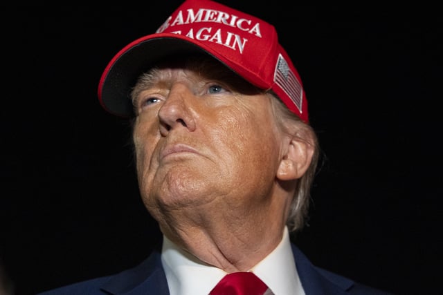 President Donald Trump speaks with reporters as he arrives on Air Force One, Friday, July 4, 2025, at Joint Base Andrews, Md.