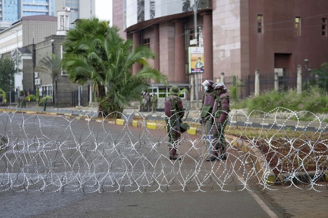 ADDITION: CLARIFIES DATE - Anti-riot police barricade roads to Parliament buildings with razor wire, ahead of demonstrations to mark the historic 1990 Saba Saba (a Swahili word that means seven seven) protests for democratic reforms in Nairobi, Kenya, Monday, July 7, 2025. (AP Photo/Brian Inganga)