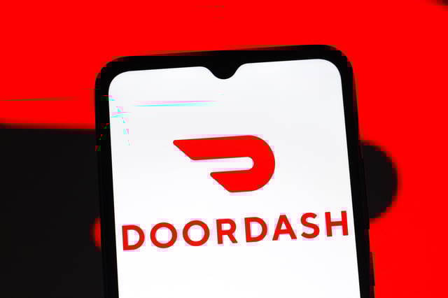 In this photo illustration, the DoorDash logo is seen displayed on a smartphone screen.