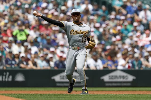SEATTLE, WASHINGTON - JULY 04: Ke&#39;Bryan Hayes #13 of the Pittsburgh Pirates throws to first base during the game against the Seattle Mariners at T-Mobile Park on July 04, 2025 in Seattle, Washington. The Seattle Mariners won 6-0.