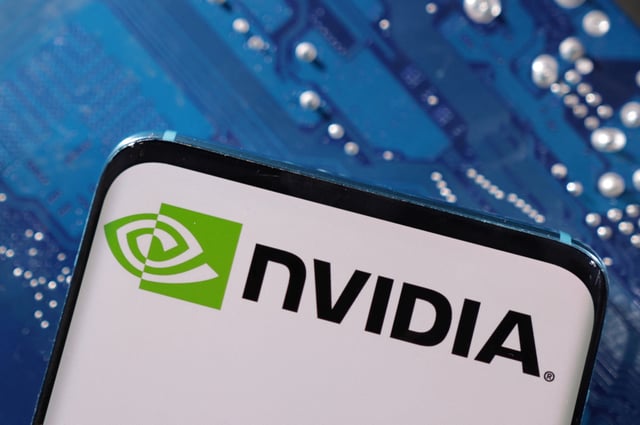 A smartphone with a displayed NVIDIA logo is placed on a computer motherboard in this illustration taken March 6, 2023. REUTERS/Dado Ruvic/Illustration
