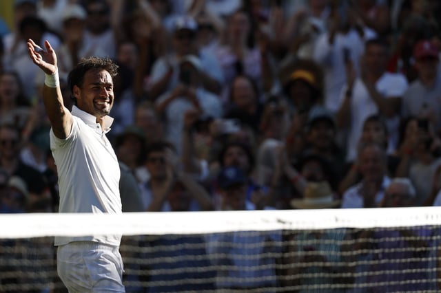 Jun 30, 2025; Wimbledon, United Kingdom; Fabio Fognini (ITA) waves to the crowd while leaving the court after his match against Carlos Alcaraz (ESP)(not pictured) in what is his final match at Wimbledon on day one of The Championships, Wimbledon 2025 at All England Lawn Tennis and Croquet Club. Mandatory Credit: Geoff Burke-Imagn Images
