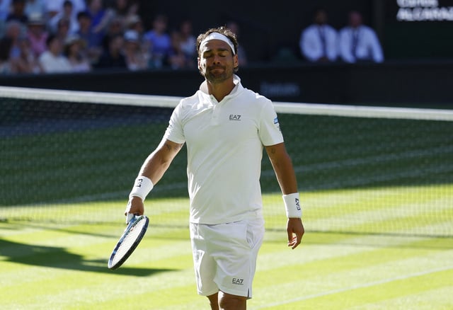 Tennis - Wimbledon - All England Lawn Tennis and Croquet Club, London, Britain - June 30, 2025 Italy's Fabio Fognini reacts during his first round match against Spain's Carlos Alcaraz REUTERS/Stephanie Lecocq