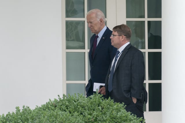 President Joe Biden walks along the Colonnade at the White House with his physician Kevin O&#39;Connor, Aug. 28, 2023.